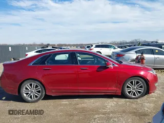 2015 Lincoln MKZ z VIN 3LN6L2G9XFR618075, wystawiony jako IAAI lot #41469247 z przebiegiem 152 966 mil mil oraz . Historia ofert i sprzedaży dostępna na DreamBid. Obrazek 13.