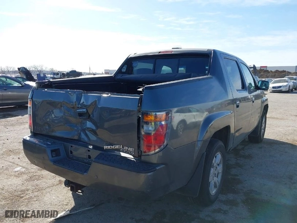 2007 Honda Ridgeline RTL w/Leather with VIN 2HJYK16547H526249, listed as a IAAI auction lot 41769625 with 173,168 mi miles. Bid and sale history available at carsss.com. Image 4.