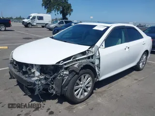 2012 Toyota Camry XLE z VIN 4T1BD1FK0CU007194, wystawiony jako IAAI lot #42281914 z przebiegiem 186 379 mil mil oraz . Historia ofert i sprzedaży dostępna na DreamBid. Obrazek 18.