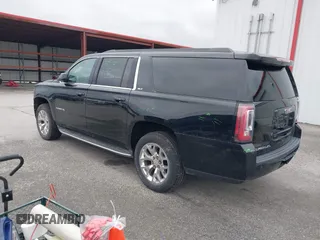 2015 GMC Yukon XL SLT with VIN 1GKS2HKC6FR746809, listed as a IAAI auction lot 41559570 with 144,401 mi miles. Bid and sale history available at carsss.com. Image 3.