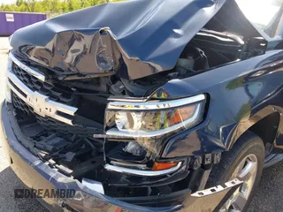 2018 Chevrolet Tahoe LT with VIN 1GNSCBKC0JR138385, listed as a IAAI auction lot 41977300 with 104,987 mi miles and . Bid and sale history available at DreamBid. Image 6.