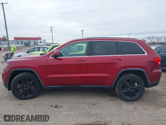 2013 Jeep Grand Cherokee Laredo with VIN 1C4RJEAG4DC573971, listed as a IAAI auction lot 41627288 with 143,256 mi miles. Bid and sale history available at carsss.com. Image 14.