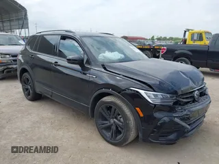 2023 Volkswagen Tiguan SE R-Line Black with VIN 3VVCB7AX0PM122636, listed as a IAAI auction lot 42040494 with 8,589 mi miles and . Bid and sale history available at DreamBid. Image 1.