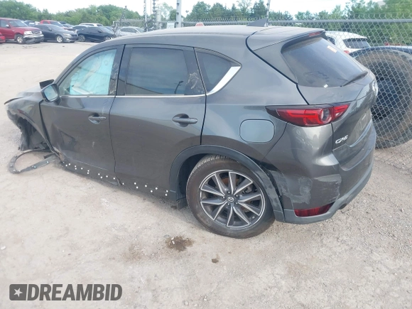 2018 Mazda CX-5 Grand Touring z VIN JM3KFADM5J1365772, wystawiony jako IAAI lot #42251805 z przebiegiem 44 599 mil mil oraz . Historia ofert i sprzedaży dostępna na DreamBid. Obrazek 3.