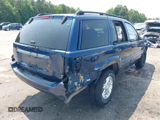 2002 Jeep Grand Cherokee Laredo with VIN 1J8GW48SX2C270339, listed as a IAAI auction lot 42390842 with Not provided miles and . Bid and sale history available at DreamBid. Image 4.
