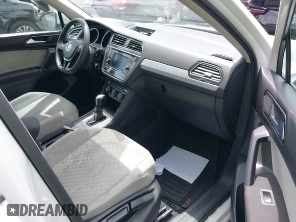 2018 Volkswagen Tiguan S with VIN 3VV1B7AX8JM032990, listed as a IAAI auction lot 42279807 with 74,185 mi miles and . Bid and sale history available at DreamBid. Image 5.