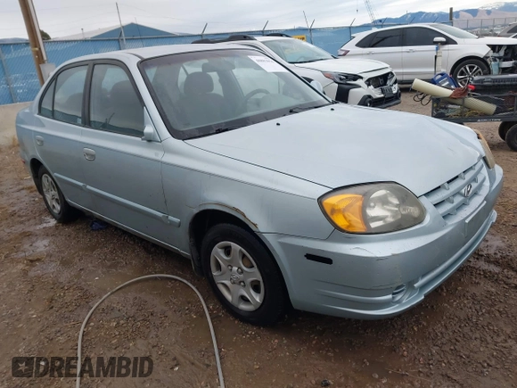 2003 Hyundai Accent GL z VIN KMHCG45C43U465523, wystawiony jako IAAI lot #40883056 z przebiegiem 95 770 mil mil oraz . Historia ofert i sprzedaży dostępna na DreamBid. Obrazek 1.