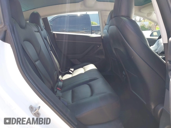 2020 Tesla Model 3 Standard Range Plus with VIN 5YJ3E1EAXLF590591, listed as a IAAI auction lot 42140338 with 79,342 mi miles and . Bid and sale history available at DreamBid. Image 8.