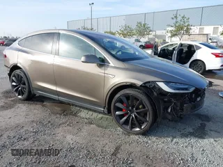 2016 Tesla Model X P90D with VIN 5YJXCAE45GF000773, listed as a IAAI auction lot 42052642 with 127,670 mi miles. Bid and sale history available at carsss.com. Image 1.