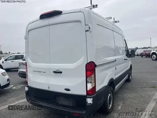 2021 Ford Transit Cargo z VIN 1FTYE1C84MKA94597, wystawiony jako IAAI lot #42704426 z przebiegiem 74 850 mil mil oraz . Historia ofert i sprzedaży dostępna na DreamBid. Obrazek 7.