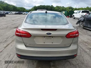 2015 Ford Focus SE z VIN 1FADP3F29FL312757, wystawiony jako Copart lot #61198315 z przebiegiem 84 944 mil mil oraz Szkoda całkowita • Salvage title. Historia ofert i sprzedaży dostępna na DreamBid. Obrazek 6.