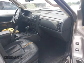 2004 Jeep Grand Cherokee Laredo with VIN 1J4GX48N04C435603, listed as a IAAI auction lot 42274197 with 256,163 mi miles and . Bid and sale history available at DreamBid. Image 5.