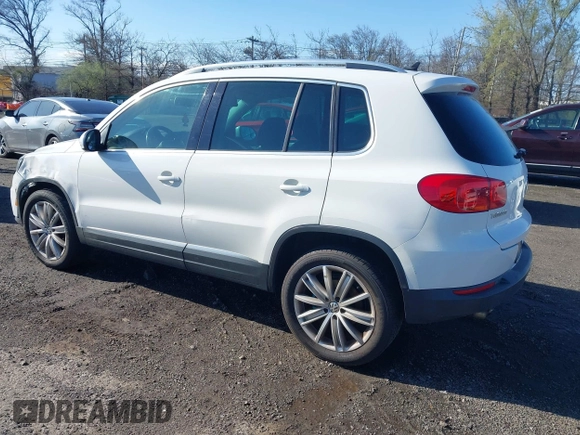 2013 Volkswagen Tiguan SE with VIN WVGBV7AX7DW511699, listed as a IAAI auction lot 41970908 with 164,758 mi miles and . Bid and sale history available at DreamBid. Image 3.