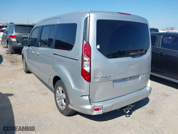 2015 Ford Transit Connect Wagon XLT with VIN NM0GE9F73F1176890, listed as a IAAI auction lot 41616697 with 128,674 mi miles. Bid and sale history available at carsss.com. Image 3.