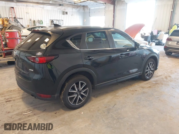 2018 Mazda CX-5 Touring with VIN JM3KFBCM9J0437490, listed as a IAAI auction lot 42006998 with 176,959 mi miles. Bid and sale history available at carsss.com. Image 4.