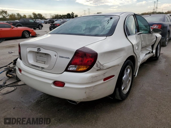 2003 Oldsmobile Aurora z VIN 1G3GS64C834100084, wystawiony jako Copart lot #76966704 z przebiegiem 70 263 mil mil oraz Szkody całkowita. Historia ofert i sprzedaży dostępna na DreamBid. Obrazek 3.