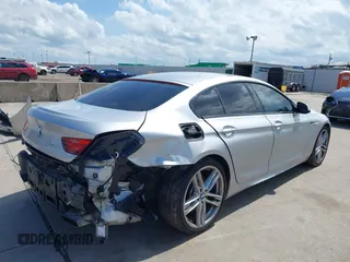 2015 BMW 6 Series 650i z VIN WBA6B2C55FGB99196, wystawiony jako IAAI lot #42107698 z przebiegiem 74 393 mil mil oraz . Historia ofert i sprzedaży dostępna na DreamBid. Obrazek 4.