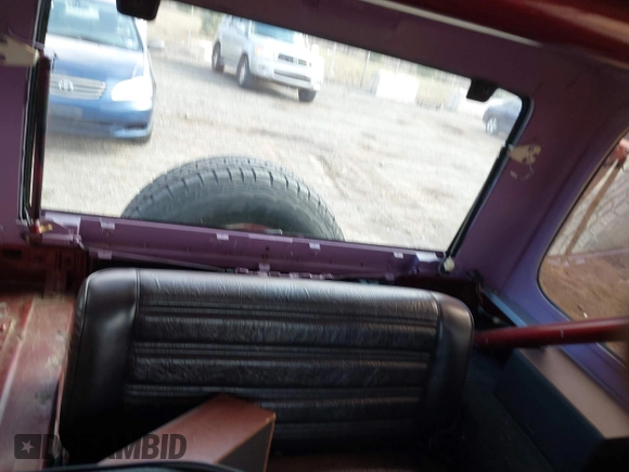 1987 Jeep Wrangler Laredo with VIN 2BCCZ8148HB535575, listed as a IAAI auction lot 41889583 with 221,521 mi miles. Bid and sale history available at carsss.com. Image 8.