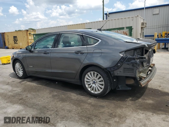 2015 Ford Fusion SE Hybrid with VIN 3FA6P0LUXFR220930, listed as a Copart auction lot 58407235 with 179,682 mi miles and Salvage title. Bid and sale history available at DreamBid. Image 2.