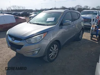 2013 Hyundai Tucson GLS with VIN KM8JU3AC0DU572232, listed as a IAAI auction lot 41724332 with 232,661 mi miles. Bid and sale history available at carsss.com. Image 2.