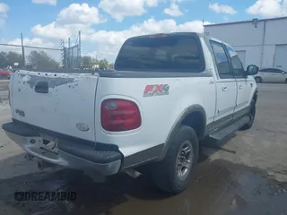 2002 Ford F-150 XLT with VIN 1FTRW08L02KA10457, listed as a IAAI auction lot 41704625 with 151,072 mi miles. Bid and sale history available at carsss.com. Image 4.