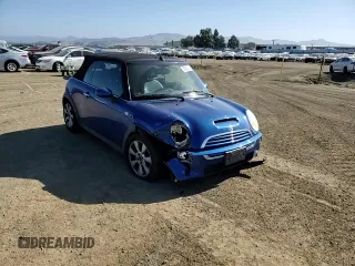 2005 MINI Convertible S z VIN WMWRH33565TK56154, wystawiony jako Copart lot #55860025 z przebiegiem 59 672 mil mil oraz Szkoda całkowita • Salvage title. Historia ofert i sprzedaży dostępna na DreamBid. Obrazek 13.