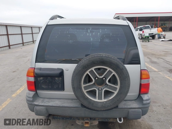 2003 Chevrolet Tracker z VIN 2CNBE134736919970, wystawiony jako IAAI lot #42203446 z przebiegiem 158 872 mil mil oraz . Historia ofert i sprzedaży dostępna na DreamBid. Obrazek 16.