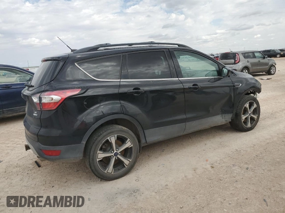 2017 Ford Escape SE with VIN 1FMCU9G93HUB66829, listed as a Copart auction lot 69093414 with 99,569 mi miles and Salvage Title. Bid and sale history available at carsss.com. Image 3.