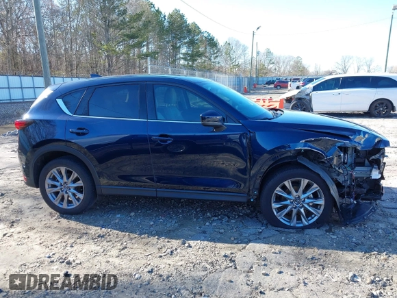 2021 Mazda CX-5 Grand Touring with VIN JM3KFADM5M0428279, listed as a IAAI auction lot 41747175 with 49,579 mi miles. Bid and sale history available at carsss.com. Image 14.