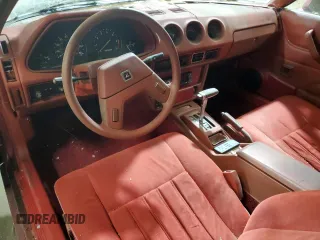 1981 Datsun 280ZX z VIN JN1HZ04S1BX414616, wystawiony jako Copart lot #82249204 z przebiegiem 114 028 mil mil oraz Tytuł czysty. Historia ofert i sprzedaży dostępna na DreamBid. Obrazek 8.