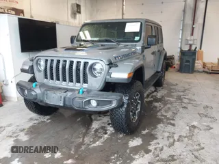 2021 Jeep Wrangler Unlimited Rubicon z VIN 1C4JJXR65MW675010, wystawiony jako IAAI lot #41990021 z przebiegiem 73 406 mil mil oraz . Historia ofert i sprzedaży dostępna na DreamBid. Obrazek 2.