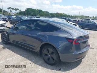 2023 Tesla Model 3 with VIN 5YJ3E1EAXPF575448, listed as a IAAI auction lot 42019288 with 33,859 mi miles and . Bid and sale history available at carsss.com. Image 3.