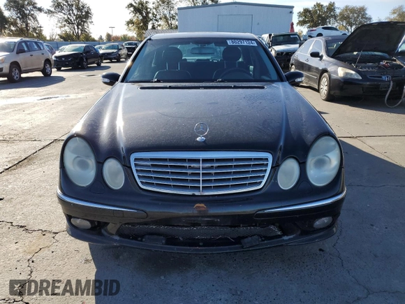 2004 Mercedes-Benz E-Class 5.0L with VIN WDBUF70J64A585084, listed as a Copart auction lot 80297124 with 233,638 mi miles and Salvage Title. Bid and sale history available at carsss.com. Image 5.