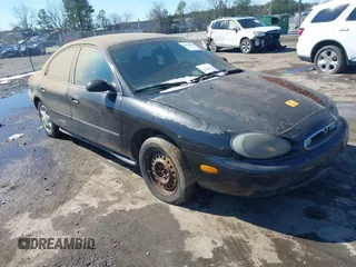 1997 Mercury Sable GS with VIN 1MELM50U7VA656293, listed as a IAAI auction lot 41651281 with 136,024 mi miles. Bid and sale history available at carsss.com. Image 1.