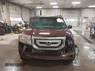 2011 Honda Pilot EX-L with VIN 5FNYF4H56BB051404, listed as a IAAI auction lot 41758332 with 301,099 mi miles. Bid and sale history available at carsss.com. Image 13.
