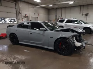 2021 Dodge Charger Scat Pack Widebody with VIN 2C3CDXGJ4MH540627, listed as a IAAI auction lot 41171991 with 31,394 mi miles and . Bid and sale history available at DreamBid. Image 14.