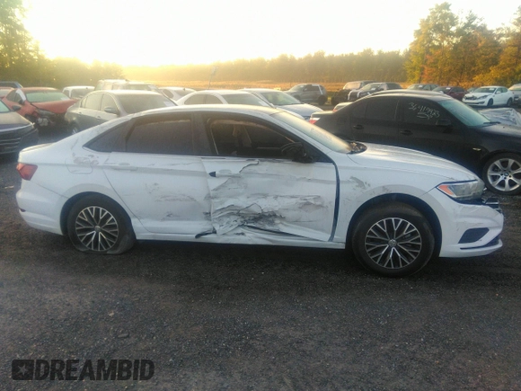2021 Volkswagen Jetta S z VIN 3VWC57BU1MM017025, wystawiony jako IAAI lot #31656882 z przebiegiem 20 664 mil mil oraz . Historia ofert i sprzedaży dostępna na DreamBid. Obrazek 13.