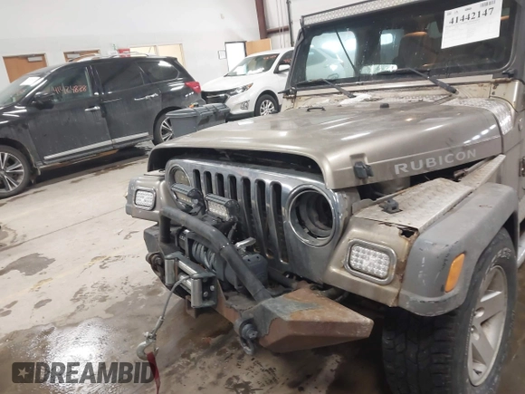 2005 Jeep Wrangler Rubicon with VIN 1J4FA69S65P311732, listed as a IAAI auction lot 41442147 with 174,277 mi miles. Bid and sale history available at carsss.com. Image 6.