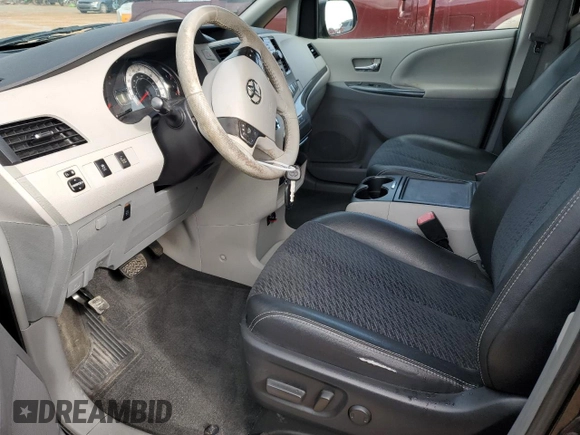 2014 Toyota Sienna SE with VIN 5TDXK3DC8ES512706, listed as a Copart auction lot 43325815 with 190,498 mi miles and Salvage Title. Bid and sale history available at DreamBid. Image 7.
