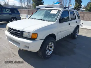 1998 Isuzu Rodeo S z VIN 4S2CK58W4W4308419, wystawiony jako IAAI lot #41711274 z przebiegiem 128 853 mil mil oraz . Historia ofert i sprzedaży dostępna na DreamBid. Obrazek 2.