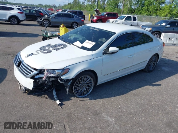 2015 Volkswagen CC R-Line with VIN WVWBN7AN3FE819870, listed as a IAAI auction lot 39390950 with 86,082 mi miles. Bid and sale history available at carsss.com. Image 2.
