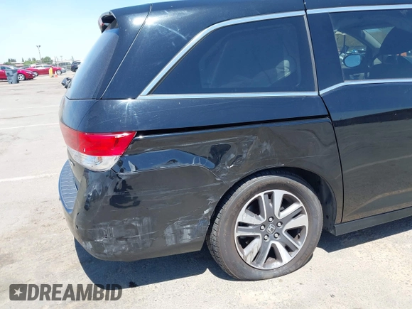 2014 Honda Odyssey Touring with VIN 5FNRL5H99EB133864, listed as a IAAI auction lot 42201359 with 122,490 mi miles and . Bid and sale history available at DreamBid. Image 6.