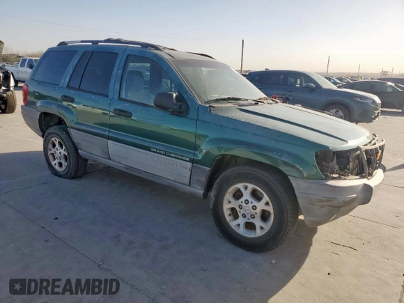 1999 Jeep Grand Cherokee Laredo with VIN 1J4G258S0XC561054, listed as a Copart auction lot 49814555 with Not provided miles and Salvage title. Bid and sale history available at DreamBid. Image 4.