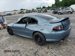 2005 Pontiac GTO z VIN 6G2VX12UX5L352121, wystawiony jako Copart lot #56840425 z przebiegiem 42 265 mil mil oraz Szkody całkowita. Historia ofert i sprzedaży dostępna na DreamBid. Obrazek 2.