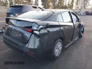2020 Toyota Prius L Eco z VIN JTDKARFU9L3122010, wystawiony jako IAAI lot #41969655 z przebiegiem 76 250 mil mil oraz . Historia ofert i sprzedaży dostępna na DreamBid. Obrazek 4.