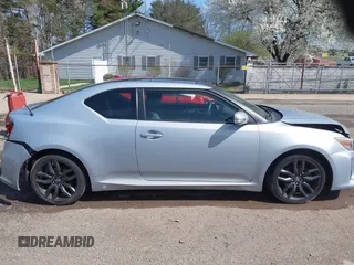 2014 Scion tC with VIN JTKJF5C70E3068144, listed as a IAAI auction lot 41983751 with 137,894 mi miles. Bid and sale history available at carsss.com. Image 13.