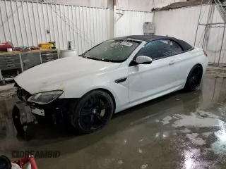 2016 BMW M6 z VIN WBS6G9C58GD932069, wystawiony jako Copart lot #55722063 z przebiegiem 61 793 mil mil oraz . Historia ofert i sprzedaży dostępna na DreamBid. Obrazek 1.
