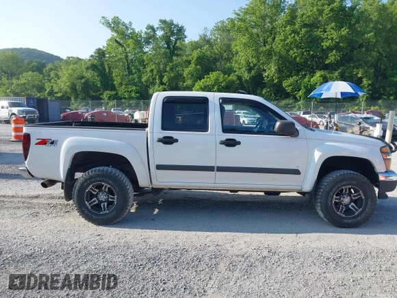 2007 Chevrolet Colorado 1LT z VIN 1GCDT13E978249656, wystawiony jako IAAI lot #42445862 z przebiegiem 115 298 mil mil oraz . Historia ofert i sprzedaży dostępna na DreamBid. Obrazek 13.