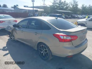 2015 Ford Focus SE with VIN 1FADP3F24FL260387, listed as a IAAI auction lot 41990194 with 80,673 mi miles. Bid and sale history available at carsss.com. Image 3.