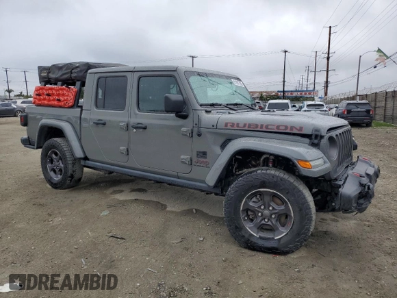2021 Jeep Gladiator Rubicon with VIN 1C6JJTBG5ML615653, listed as a Copart auction lot 51297795 with 48,918 mi miles and Salvage title. Bid and sale history available at DreamBid. Image 4.